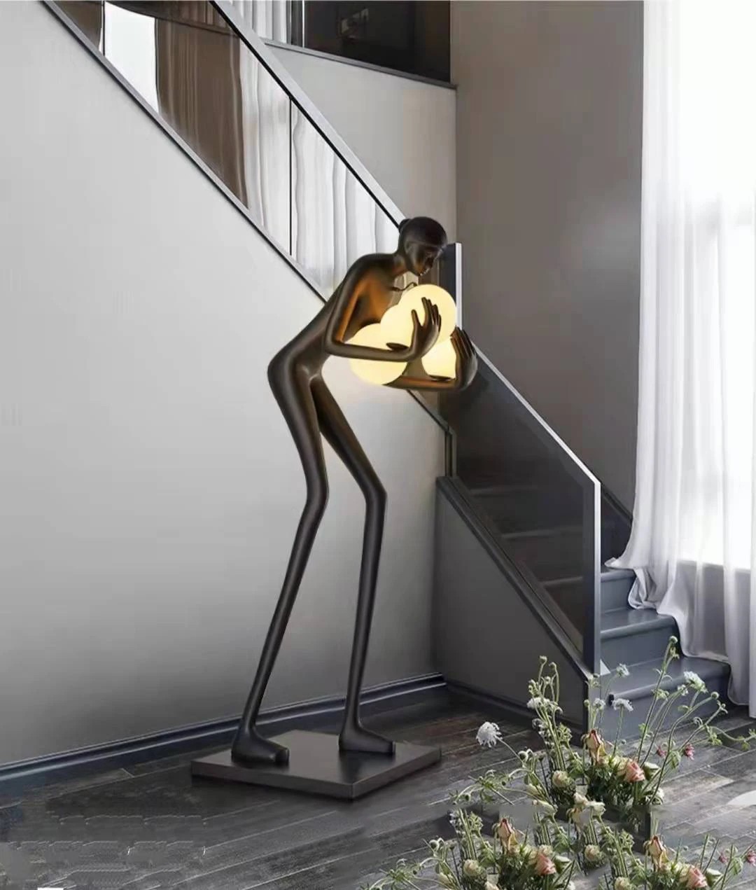 human-shaped sculpture floor lamp