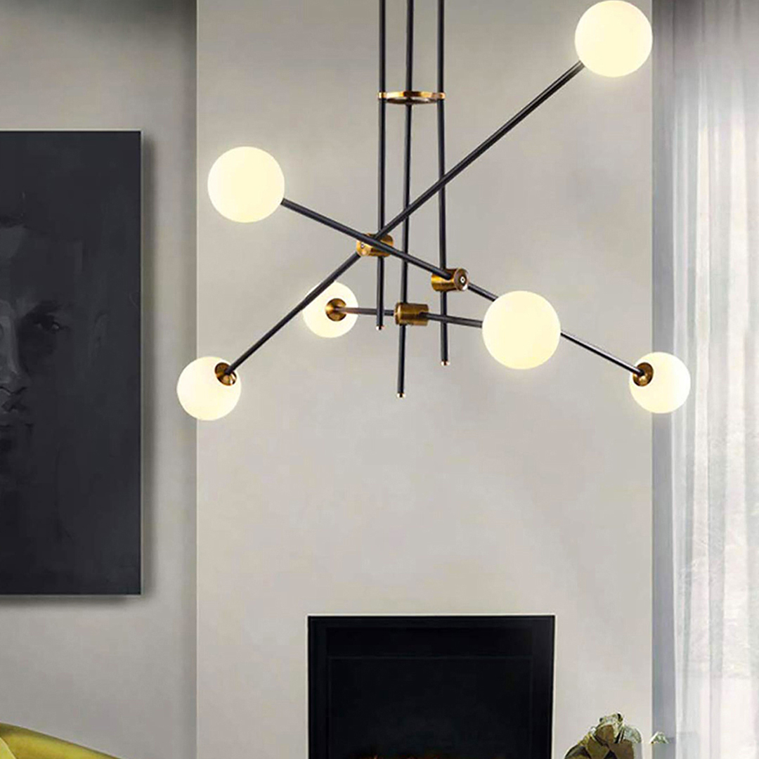  modern Sputnik-style chandelier with adjustable arms in a black and gold finish. 