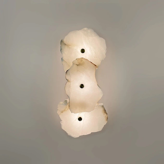 Alternative view of modern decorative wall sconce featuring irregular, translucent white marble or alabaster plates paired with brass or copper metal hardware