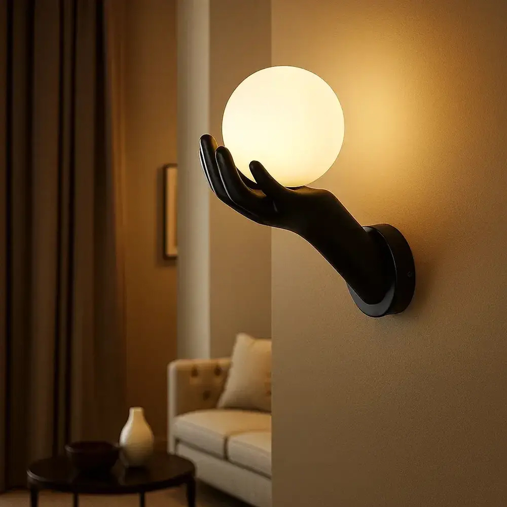 Alternative view of resin wall lamp featuring a hand-shaped design holding a globe glass shade, often referred to as a "Hand of Victory" or "Hand Light" wall fixture