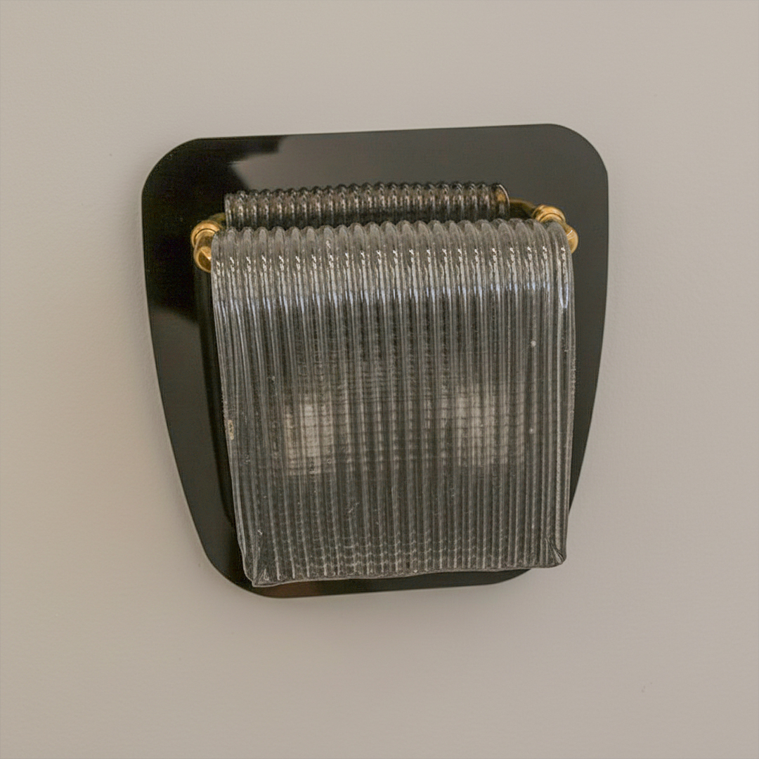 styled similarly to the Baccarat Tuile de Cristal wall lamp or vintage Murano glass sconces.