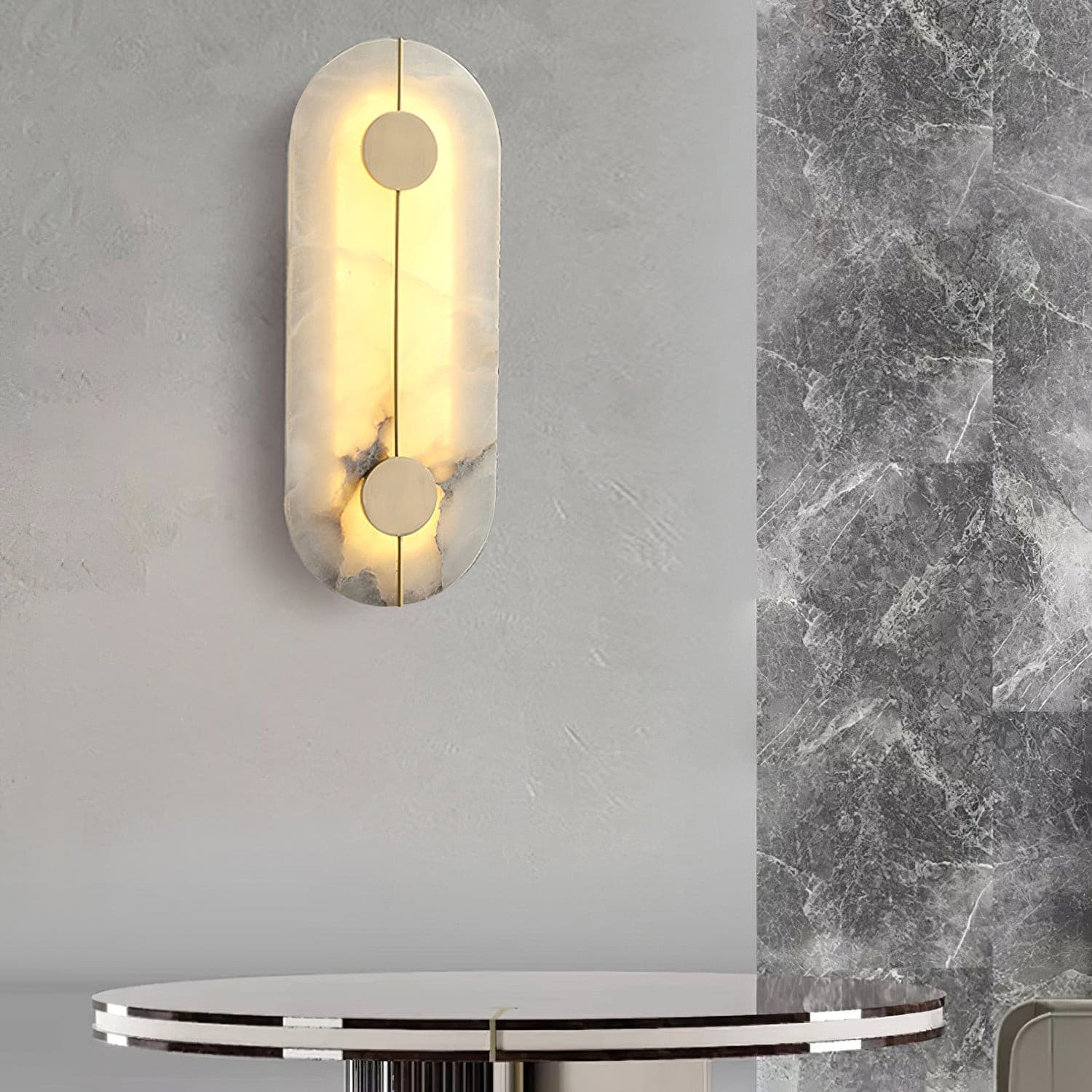 Alternative view of sconce crafted from natural marble with integrated LED lighting and brass accents