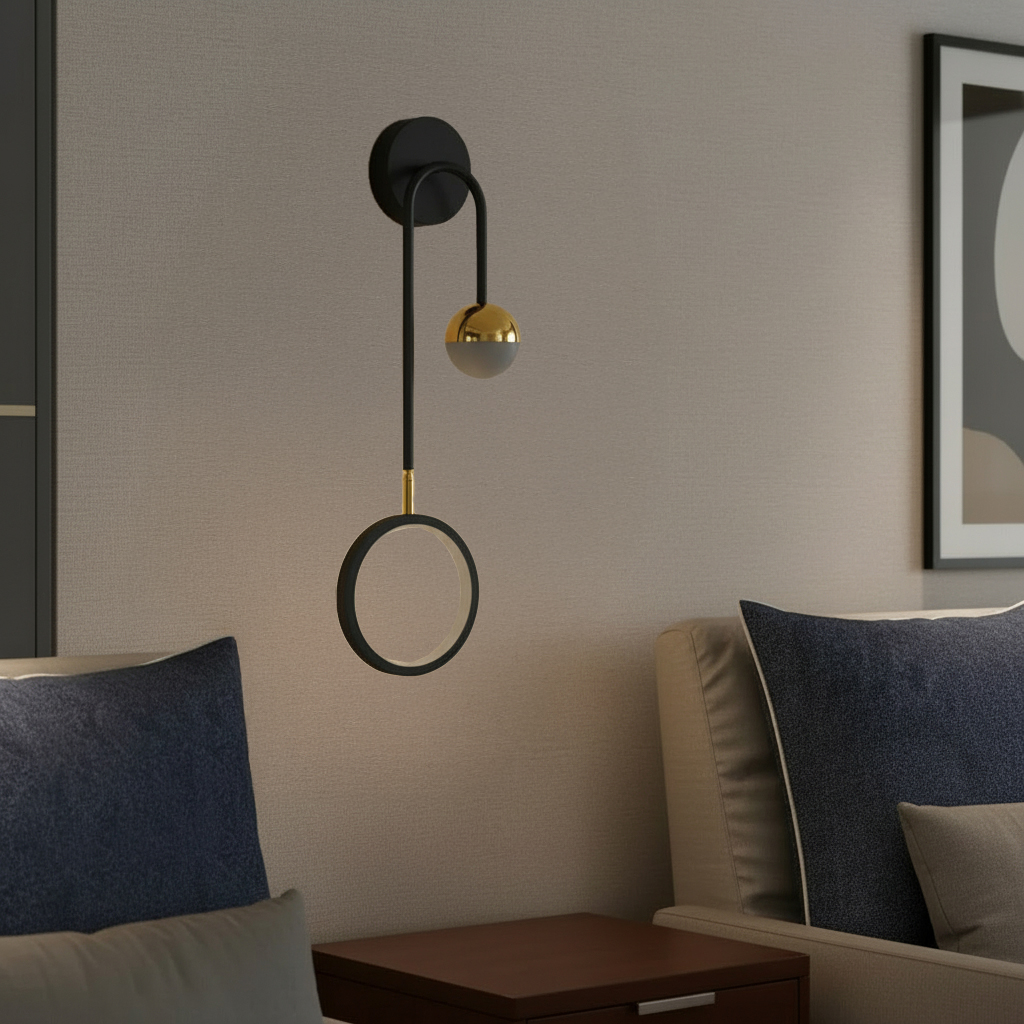 Ophelia Wall Light, a modern sconce featuring a black metal frame with a gold-finished accent and a white glass globe