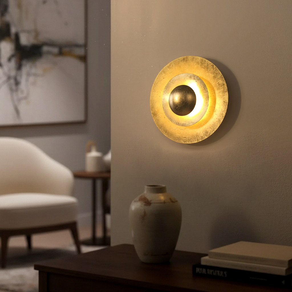 Alternative view of decorative wall light or sconce, featuring a concentric disc design with a metallic gold finish