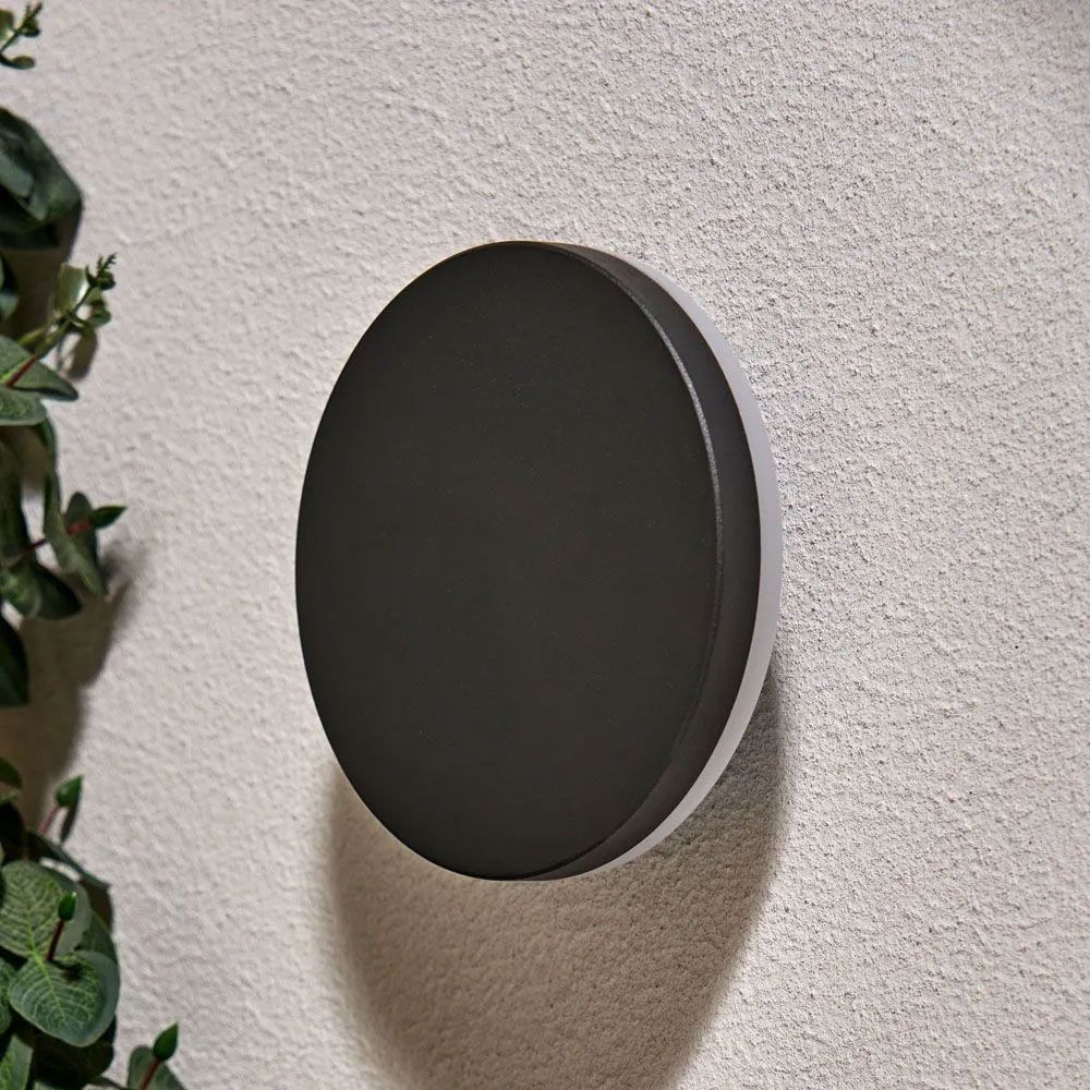 Forum Lighting Tetbury LED Round Outdoor Wall Light, featuring a sleek anthracite finish and a backlit design