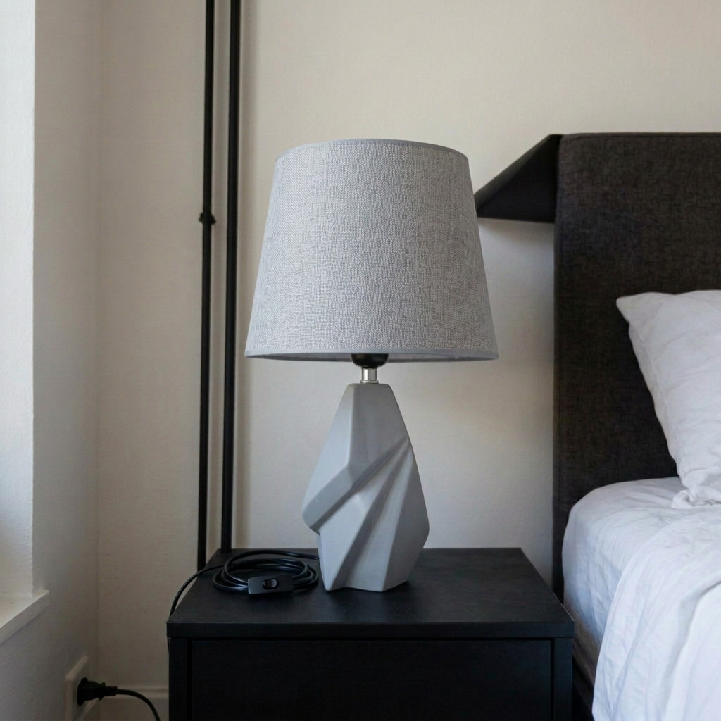 Farmhouse Table Lamp featuring a geometric gray base and a linen shade. [1]