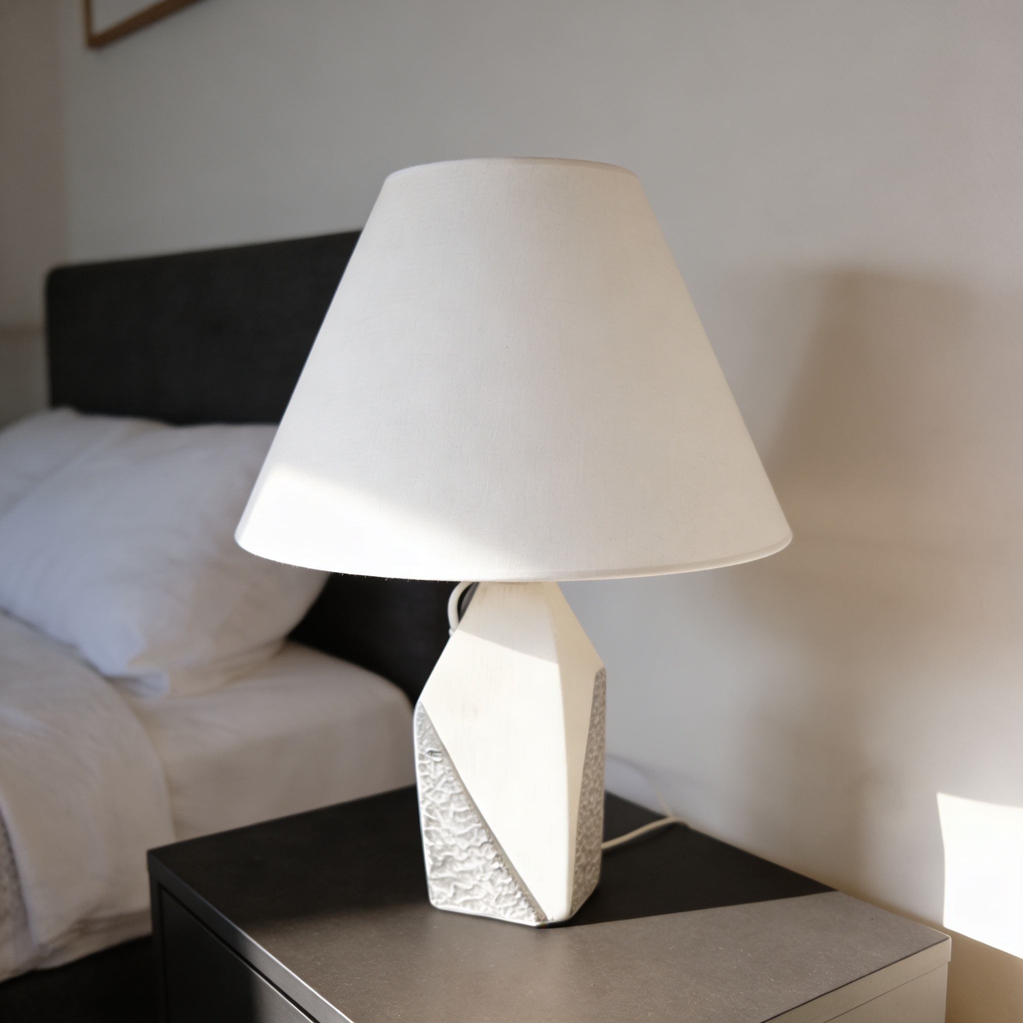 Sheppard Studio Warp Lamp featuring a textured ceramic base and a linen shade.