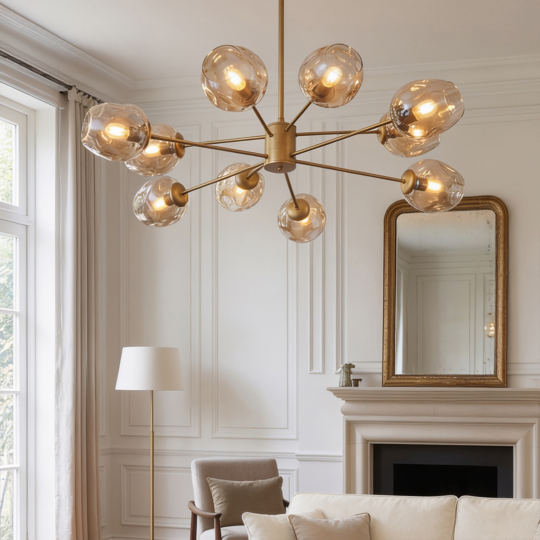 The Danube Home Burnes 10-Light Chandelier features a striking black design with amber glass globes - Gold